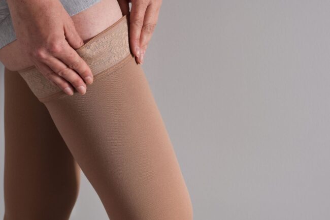 compression stockings on woman's legs